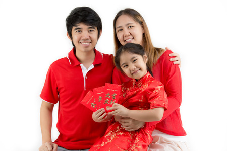 Asian family wishing you a happy Chinese new year on isolated backgroundの写真素材