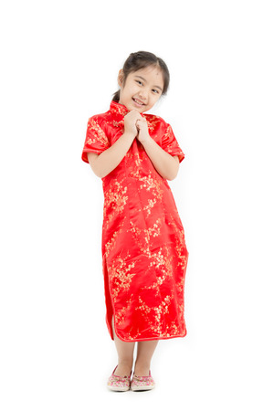 Little Asian girl wishing you a happy Chinese new year on isolatedの写真素材