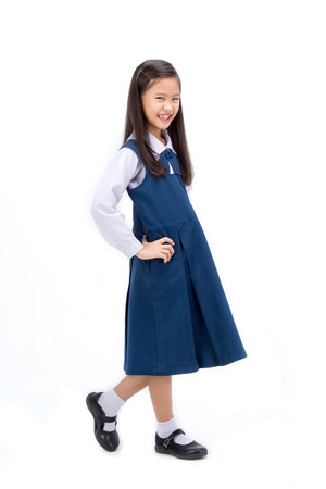 Portrait of Asian child in school uniform on isolated white backgroundの写真素材