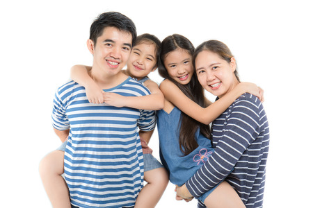 Happy Asian family on isolated white background, Happy family enjoying togetherの写真素材