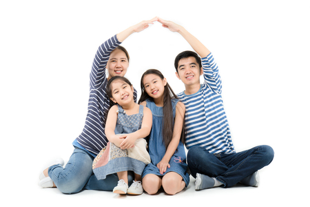 Asian family smiling and playing house by hands on isolated white backgroundの写真素材