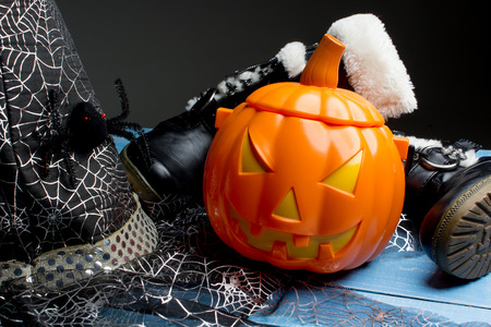 Pumpkin bucket, witch's hat and boots, Halloween decorationsの写真素材