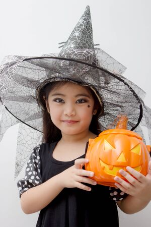 Portrait of cute girl in Halloween costume looking at cameraPortrait of cute girl in Halloween costume looking at cameraの写真素材