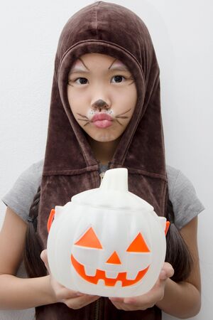 Portrait of cute girl in Halloween costume looking at cameraPortrait of cute girl in Halloween costume looking at cameraの写真素材