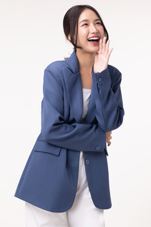 Portrait of happy young business woman posing isolated on white background.の写真素材
