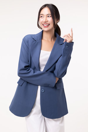 Portrait of happy young business woman posing isolated on white background.の写真素材