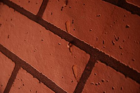 Close up red-brown/ orange brick wallpaper textureの写真素材