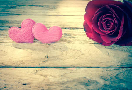 Roses and a hearts on wooden board, Valentines Day backgroundの写真素材