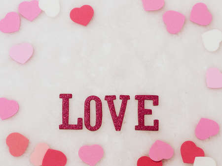 Valentines day background, word love and heart on white wool backgroundの写真素材