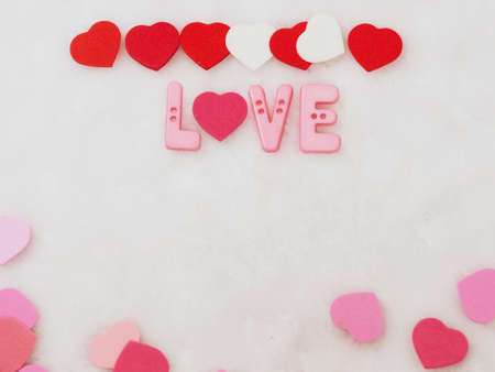 Valentines day background, word love and heart on white wool backgroundの写真素材