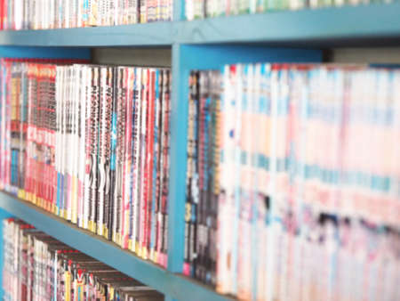 Comic books in bookshelf for backgroundの写真素材