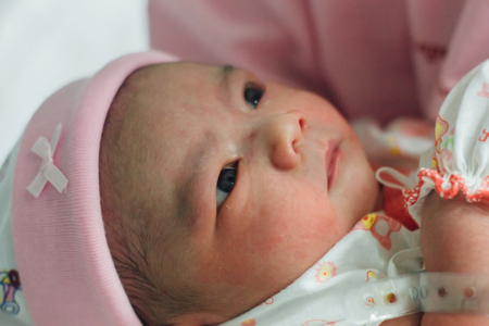 newborn baby concept : close up newborn cute Asian baby boy looking up with mother holding  : mother and baby conceptの写真素材