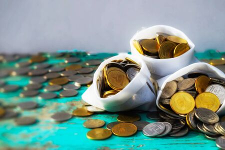 money in white bag coin saving money backgroundの写真素材