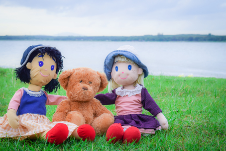 girl doll and teddy bear friendの写真素材