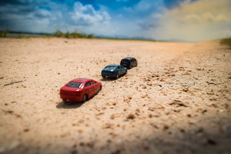 tree cars on a empty roadの写真素材