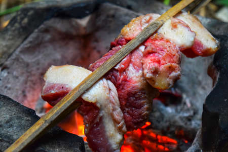 Beef steaks on flaming grillの写真素材