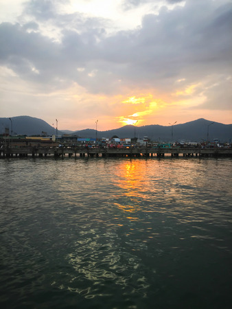 sunset sea and mountainの写真素材