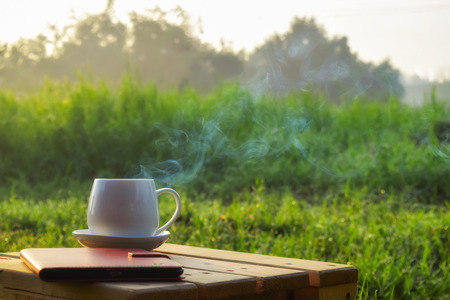 morning coffee cup garden backgroundの写真素材