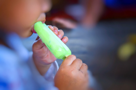 Children eat ice creamの写真素材