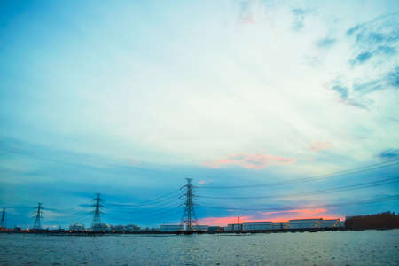 factory and High Voltage Poles in seaの写真素材