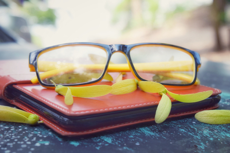 Glasses on note bookの写真素材