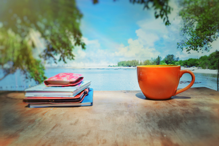Book stack with coffee mugの写真素材
