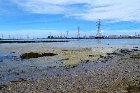 dirty sea industrial areaの写真素材