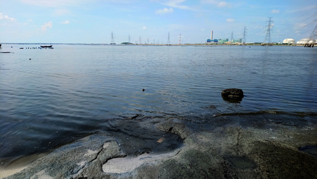 dirty sea industrial areaの写真素材