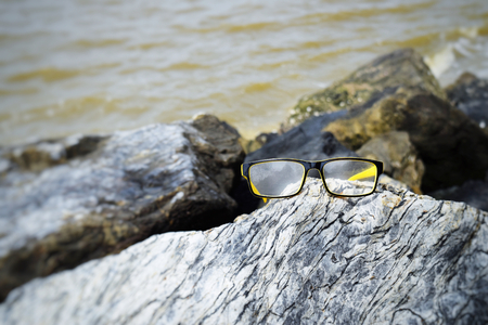 Glasses on stonesの写真素材