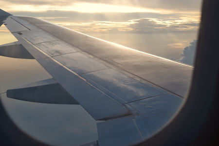 airplane wing in skyの写真素材