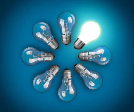Idea concept with circle of light bulbs, one of them is glowing  の写真素材