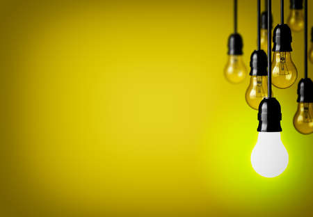 Idea concept on yellow background.の写真素材