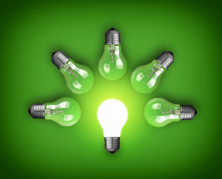Idea concept with row of light bulbs and glowing bulbの写真素材
