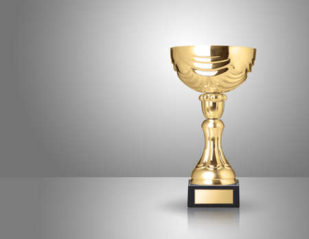 champion golden trophy over grey backgroundの写真素材
