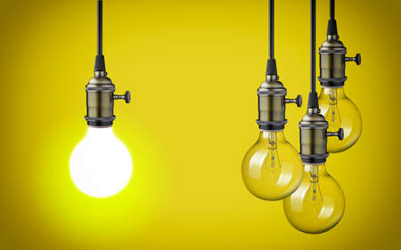 vintage light bulbs on yellow backgroundの写真素材