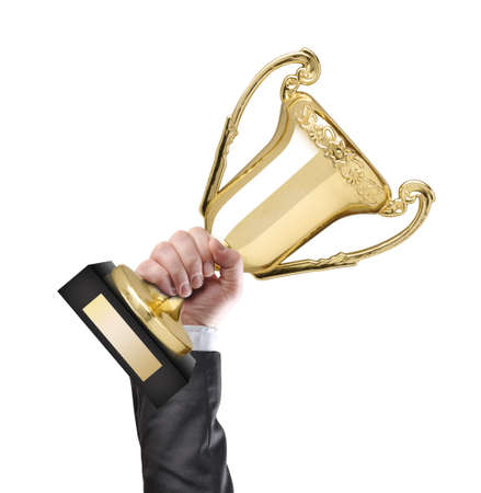 Businessman holding a golden cup trophyの写真素材