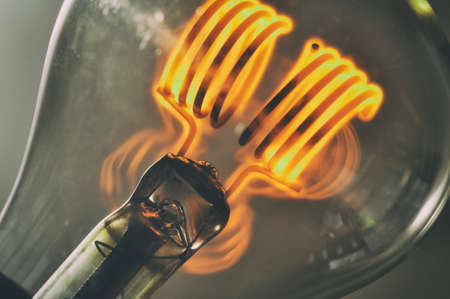 Close up glowing vintage light bulbの写真素材