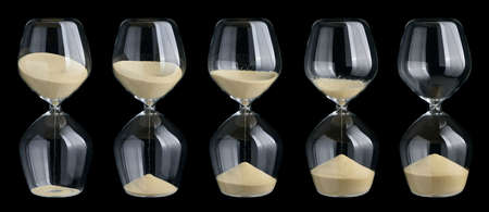 Set of hourglasses isolated on black backgroundの写真素材