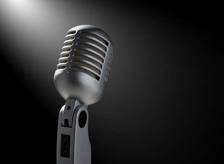 Vintage microphone on black with highlightsの写真素材