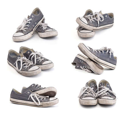 Set of old dirty sneakers isolated on white backgroundの写真素材