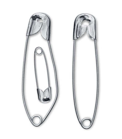 Pregnancy announcement using safety pins isolated on whiteの写真素材