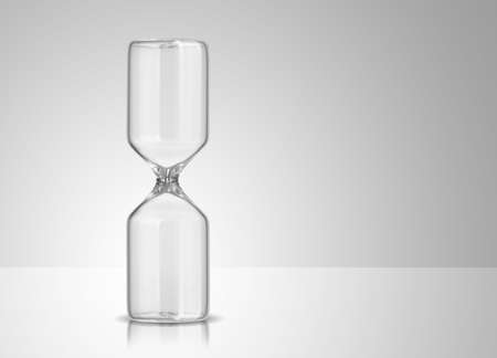 Empty hourglass on gray background