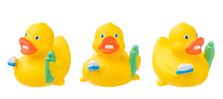 Set of rubber duck with toothpaste toothbrush. Isolated on white.の写真素材