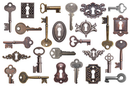 Set of old keys and keyholes isolated on white backgroundの写真素材