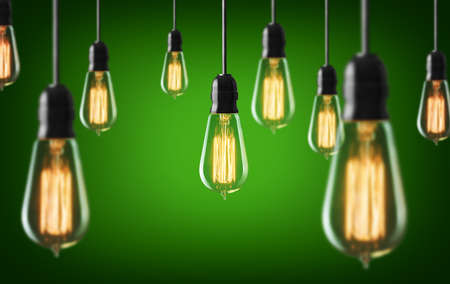 Vintage light bulbs on green backgroundの写真素材