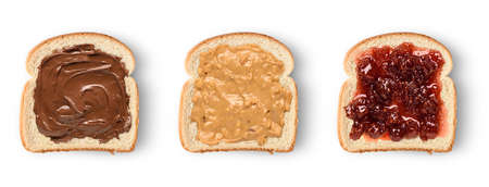 Set of three slices toast bread with chocolate spread, peanut butter and jam. Isolated on whiteの写真素材