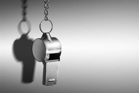 Hanging metal whistle closeup photoの写真素材