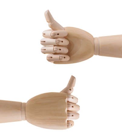 Wooden hand with thumb up. Isolated on white backgroundの写真素材