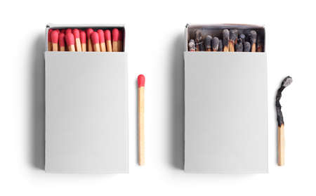 Top view of opened match boxes with burned matchsticks. Isolated on white backgroundの写真素材