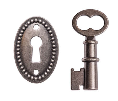 Old key and keyhole isolated on white backgroundの写真素材
